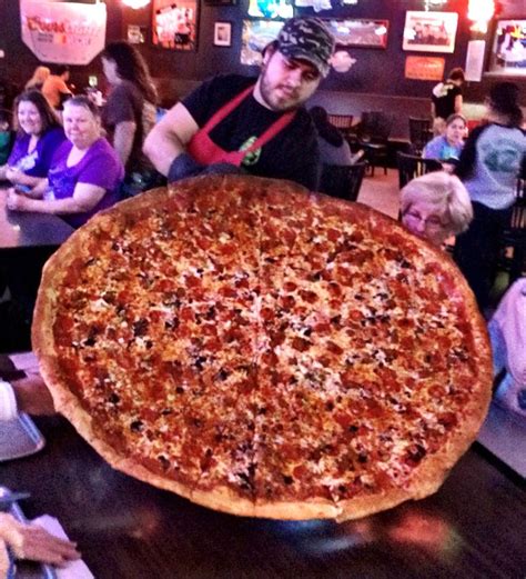 Big lou pizza - No deliveries or take out on this one, folks, since they don't have a box big enough to carry this freakin' thing. So if you must have it, you must bring friends and/or family and dine in... OR if you'd rather, try to challenge yourself to this monstrosity.